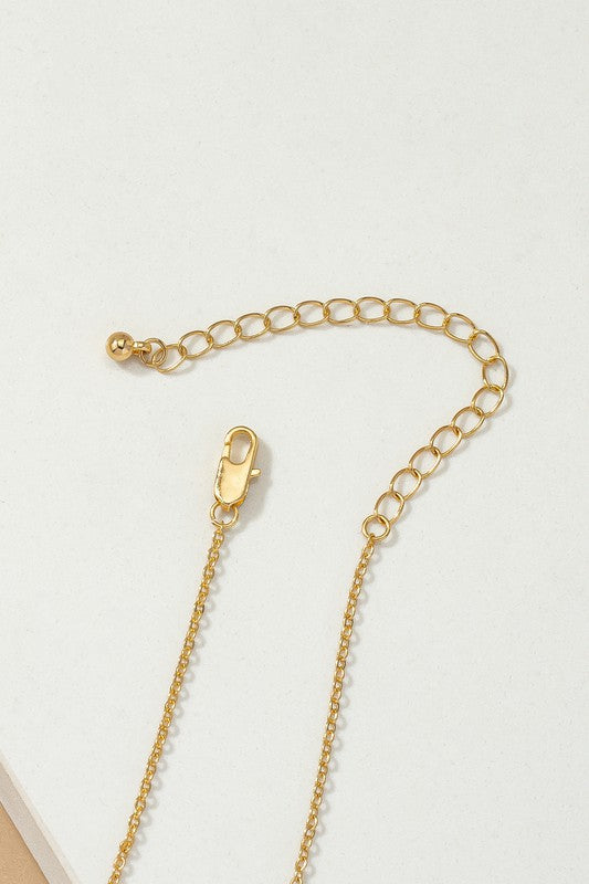 Delicate brass peace sign necklace